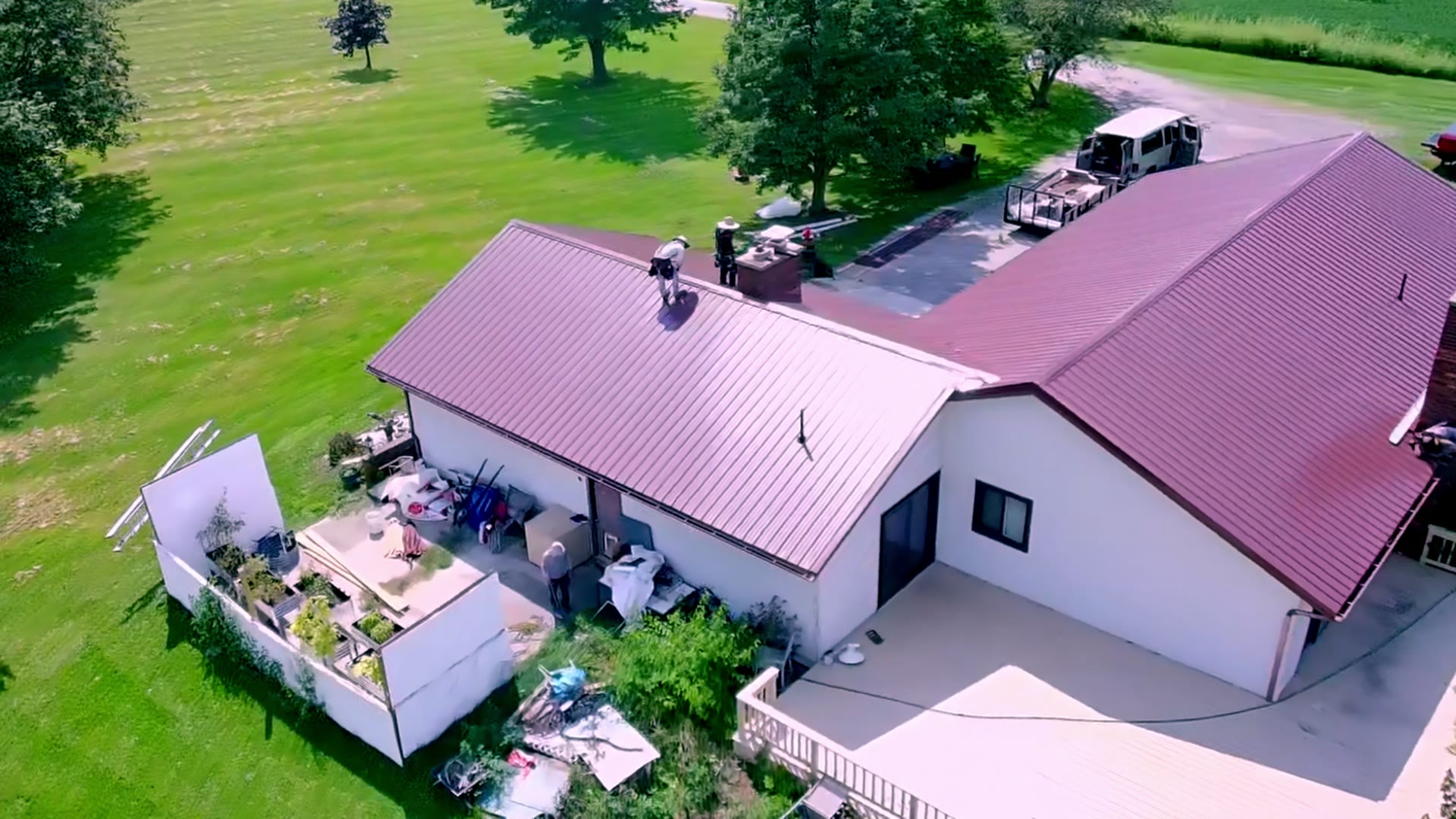 An aerial view of the crew working on a residential roof